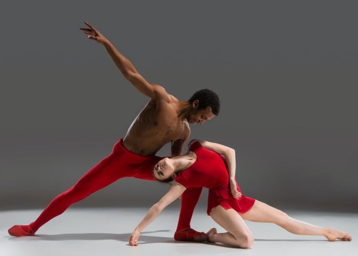 couple-of-ballet-dancers-posing-over-gray-background.jpg couple-of-ballet-dancers-posing-over-gray-background.jpg